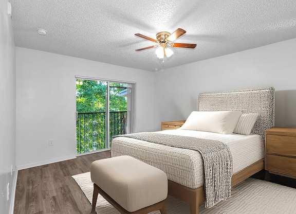 Bedroom with furniture at Cedar Grove Apartments in Miami FL