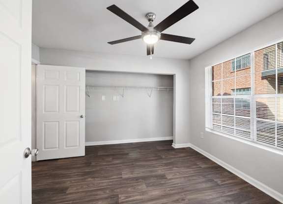 Bedroom with ceiling fan at Forest Creek Apartments in Houston TX