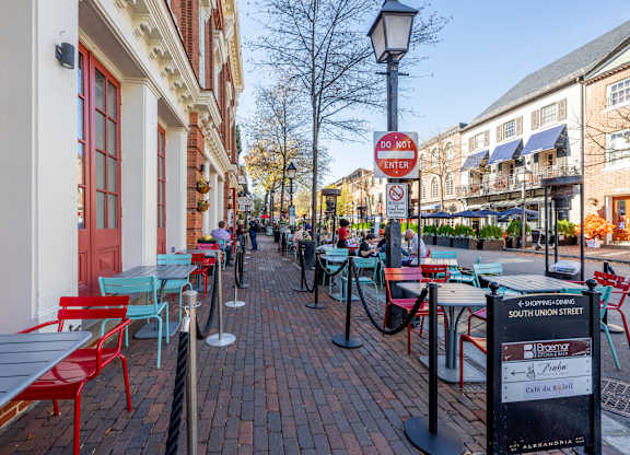A street with tables and chairs at Belhaven Apartments in Alexandria VA