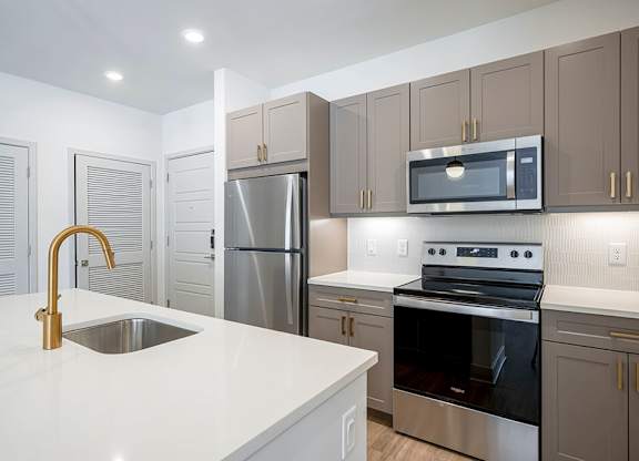 Brass Design Package Kitchen Island at The Belhaven Apartments  in Alexandria, VA