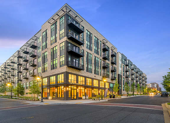 Building exterior at dusk at 333 Ellington Apartments in Gaithersburg MD