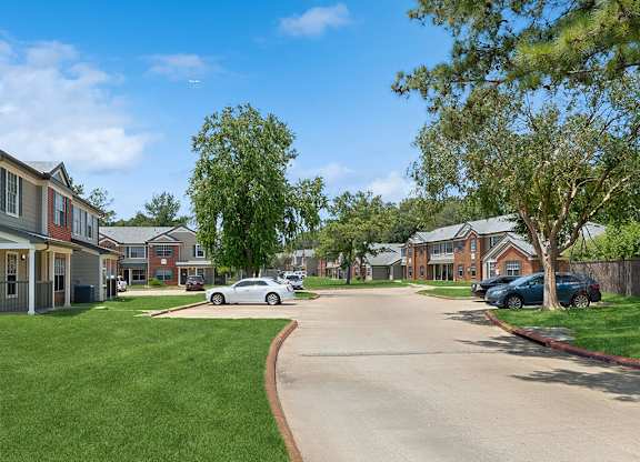 Building exterior lawn at Park Village Apartments in Conroe TX