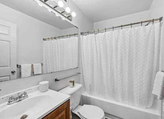 Bathroom with shower at Riverwoods Apartments in Woodbridge VA