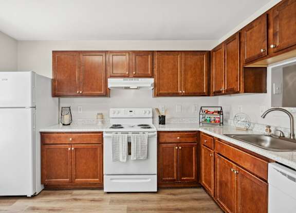Kitchen with wood cabinets at Riverwoods Apartments in Woodbridge VA