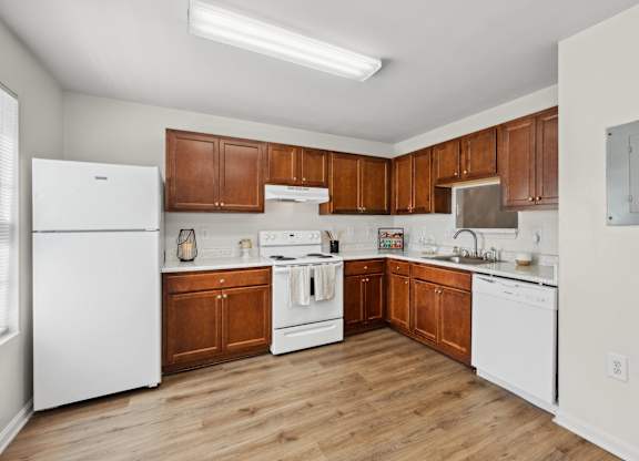 Kitchen with appliances at Riverwoods Apartments in Woodbridge VA