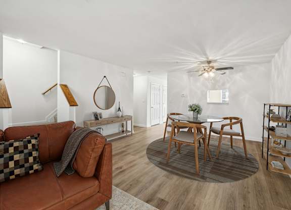 Living room with ceiling fan at Riverwoods Apartments in Woodbridge VA