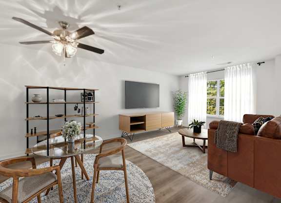 Living room with window at Riverwoods Apartments in Woodbridge VA