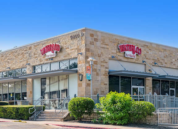 The exterior of a building with the name
