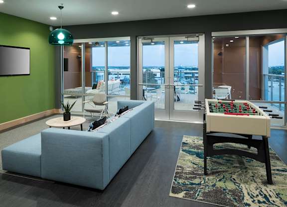 Clubhouse couch at Jada Legacy Central Apartments in Plano TX