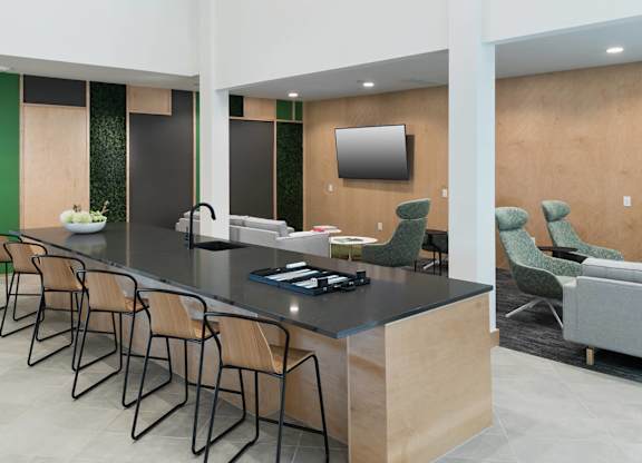 Clubhouse island seating at Jada Legacy Central Apartments in Plano TX