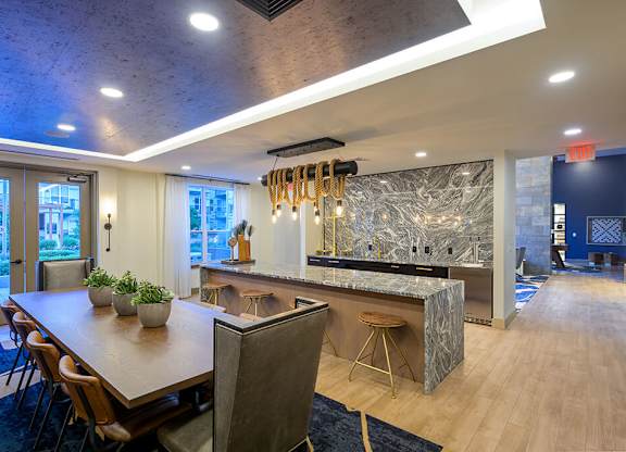 Clubroom Kitchen and Dining Table at Vero Apartments in Chelsea MA