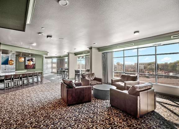 Clubhouse kitchen seating area at District at Scottsdale Apartments in Scottsdale AZ