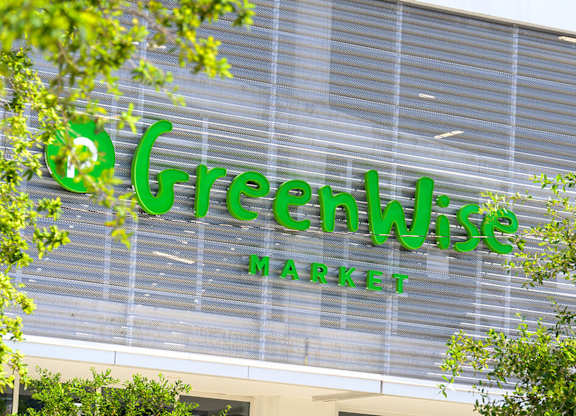 A Greenwise Market sign is displayed on a building.