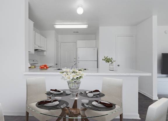A modern dining room with a glass table and white chairs.
