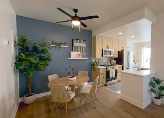 Dining room and ceiling fan at The Resort at Encinitas Apartments in Encinitas CA