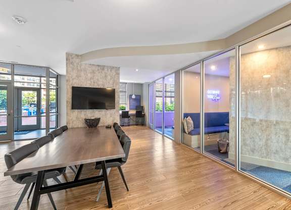 Resident clubhouse with conference table at Bradley Braddock Road Station Apartments in Alexandria VA