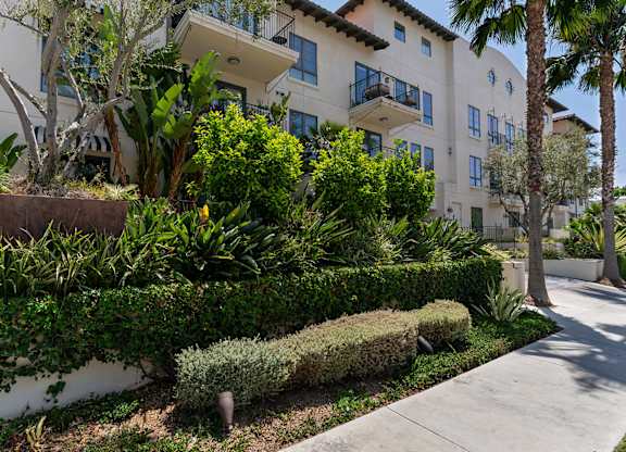 Exterior Building and Landscape at Cardio Equipment at Candara at Hancock Park Apartments in Los Angeles CA