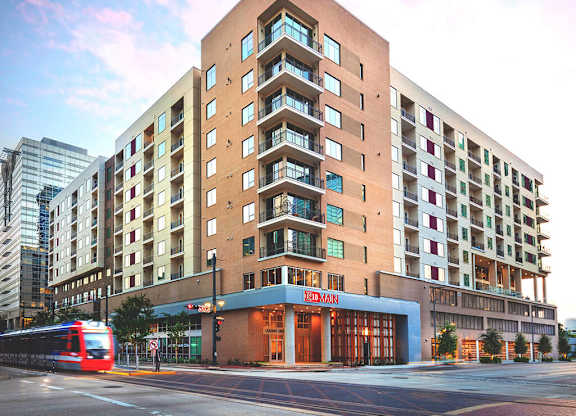 Exterior Building at Dusk at 1810 Main Apartments in Houston TX