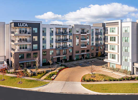 Wide shot of leasing center entry at Luca Apartments in Austin TX