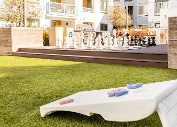 Courtyard cornhole at Bevel Apartments in San Diego CA
