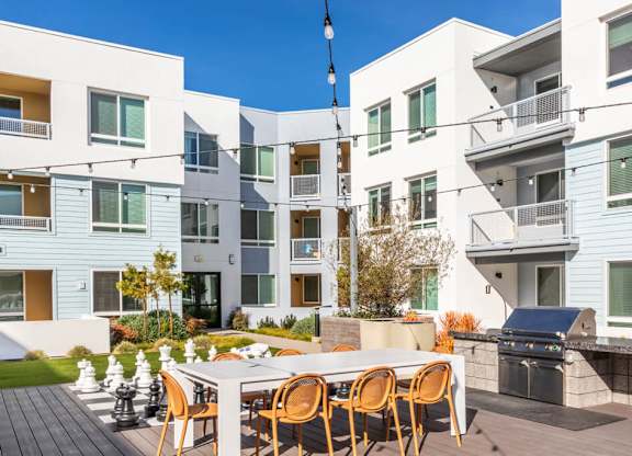 Courtyard grill seating at Bevel Apartments in San Diego CA