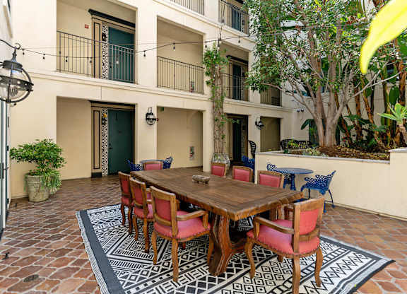 Exterior Courtyard Spanish Garden Open Air Cafe at Cardio Equipment at Candara at Hancock Park Apartments in Los Angeles CA