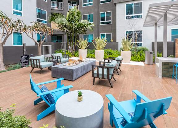 Exterior Courtyard Spark Fire Lounge and Seating at Avel Apartment Homes in Orange CA