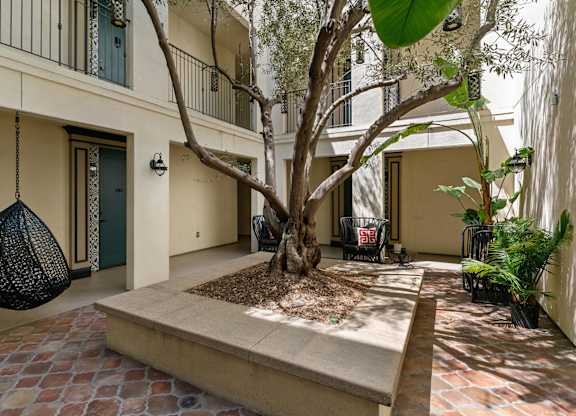 Exterior Courtyard The Wishing Tree Wi Fi Courtyard at Cardio Equipment at Candara at Hancock Park Apartments in Los Angeles CA