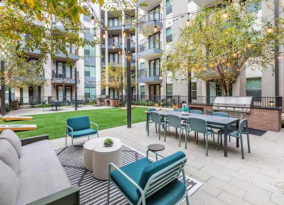 Outdoor grill seating area at Luca Apartments in Austin TX