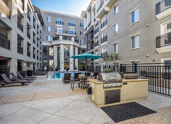 Exterior Grilling Area and Pool at Caprielle Apartments in San Diego CA