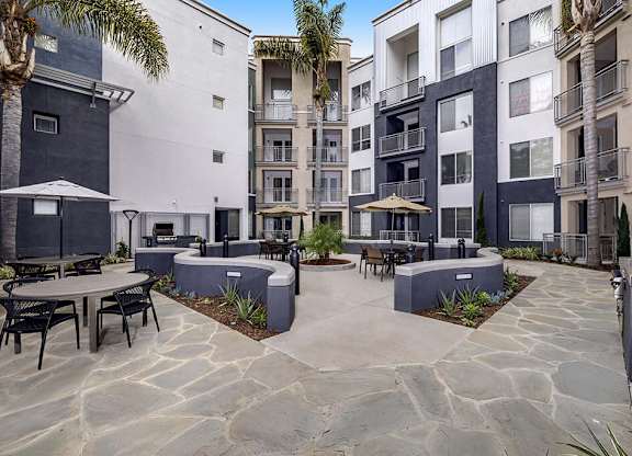 Outdoor grilling courtyard at Main and Jamboree Apartments in Irvine CA