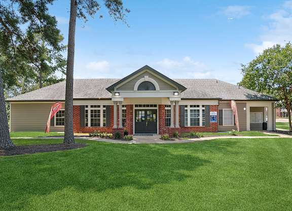 Exterior leasing office at Park Village Apartments in Conroe TX