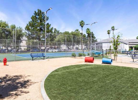 Pet park and tennis courts at Kaleidocope Apartment Homes in Las Vegas NV