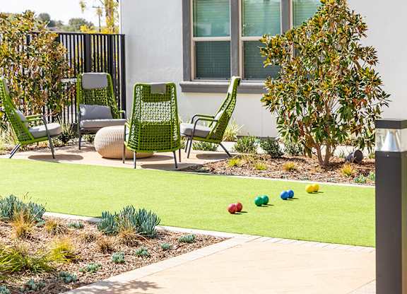 Exterior The Backyard Courtyard Bocce Ball Court Balls and Seating at West Village Poway Apartments in Poway CA