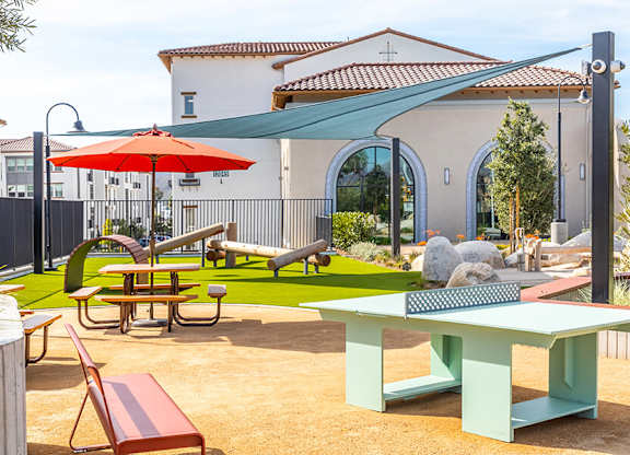 Exterior West Village Park Outdoor Games and Seating at West Village Poway Apartments in Poway CA