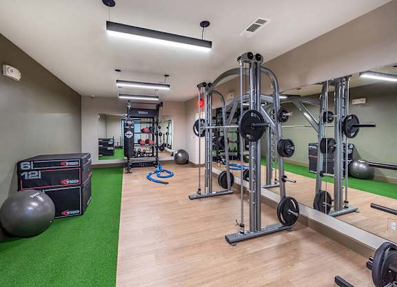 Fitness center weights at Cala Apartments in Austin TX
