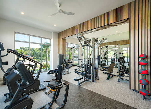 Fitness center with equipment at Treo Apartments in Fort Lauderdale FL