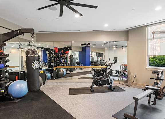 Fitness center weights area at Bradley Braddock Road Station Apartments in Alexandria VA
