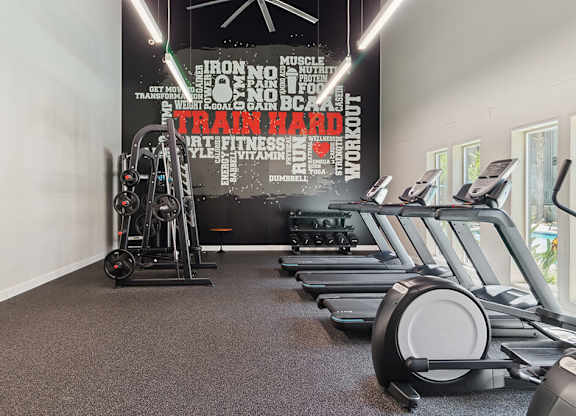 Fitness enter Virtually Staged New Renovated Primary Bedroom at Marquessa Villas Apartmetns and Townhomes in Corona CA 