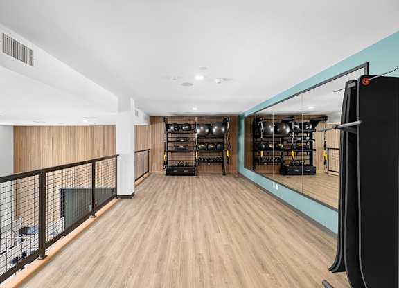Fitness center upper level at East Bend Apartments in Houston TX