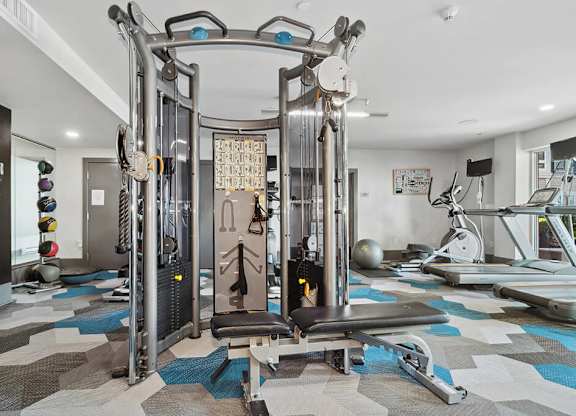 Fitness center weights at Axis Admiral Hill Apartments in Chelsea MA