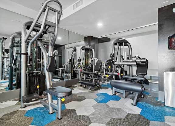 Fitness center weights at Axis Admiral Hill Apartments in Chelsea MA