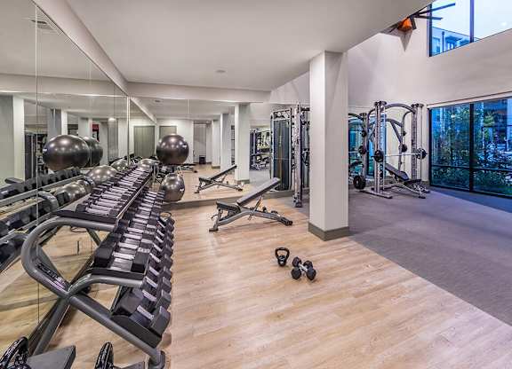 Fitness center weights at Luca Apartments in Austin TX