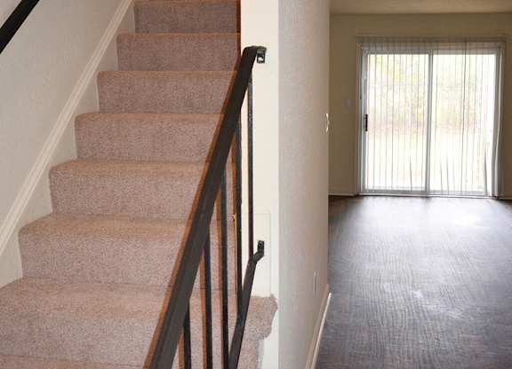Townhome staircase at Whispering Oaks Apartments in Portsmouth VA