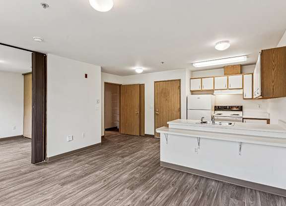 Kitchen and living area at Woodrose Senior Affordable Apartments in Bellingham WA