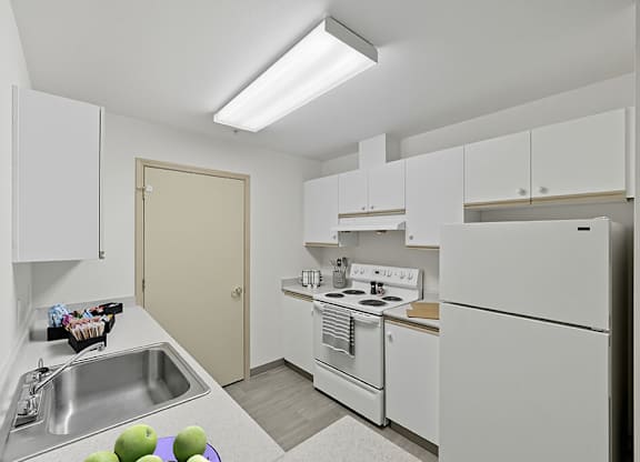 Kitchen with appliances at Alderwood Court in Lynnwood WA