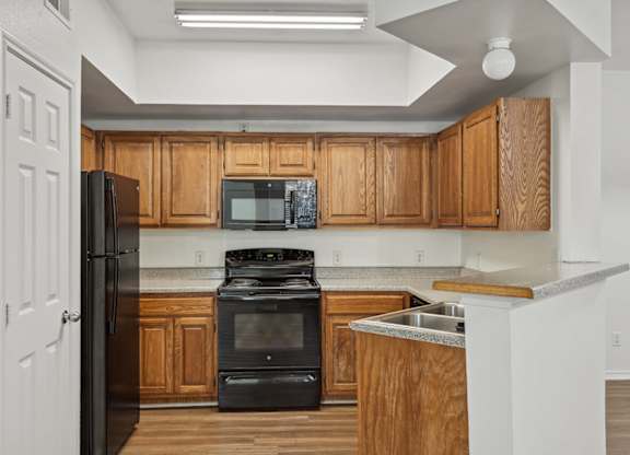 Kitchen with cabinets at Cypress View Villa Apartments in Weatherford TX