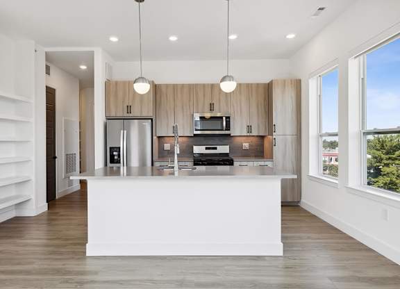 Kitchen with large windows at Jayden Apartments in Peabody MA