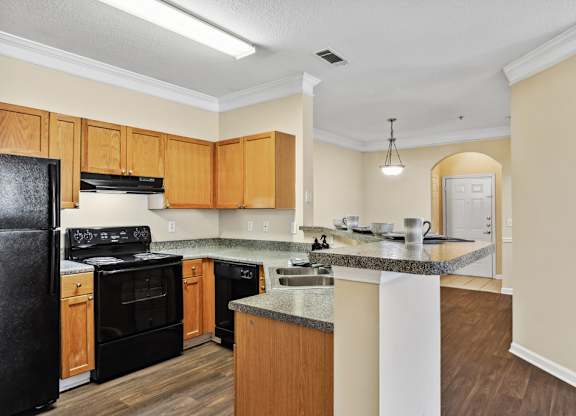 Kitchen with black appliances at Longwood Vista Apartment Homes in Atlanta GA