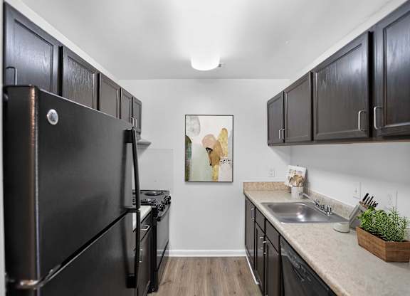 Kitchen with dark cabinets at Weston Circle Apartments in Fredericksburg VA